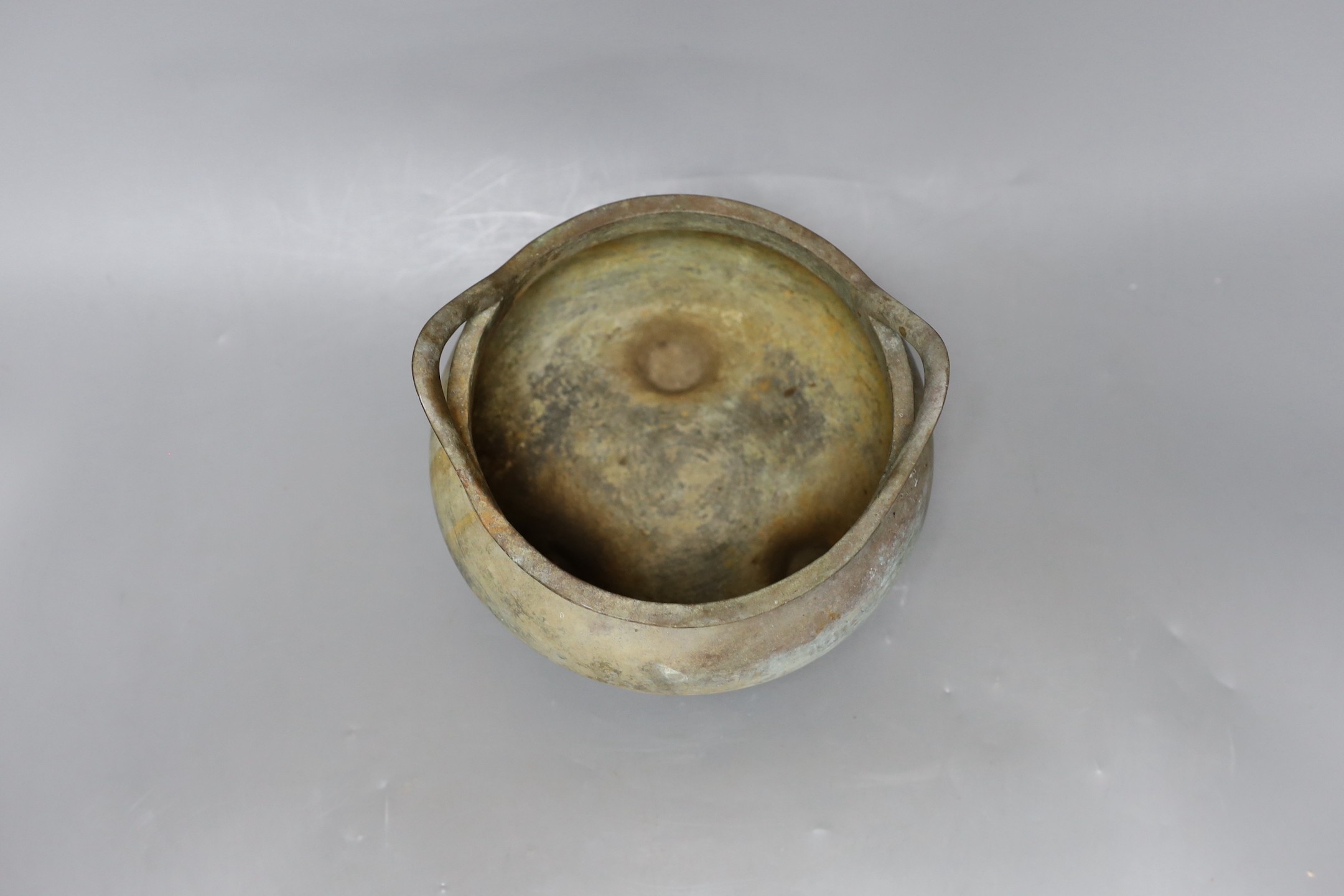 A Chinese two handled bronze censer, 18cm handle to handle